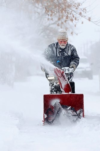 Doug Brolund is covered in frost and snow while using a snowblower to clear snow in Brandon’s east end near Rideau Park on a cold Thursday after heavy snowfall blanketed Wheat City. Environment Canada issued an extreme cold warning for Brandon yesterday and is forecasting a high of -23 C for today with a windchill of -36 C. (Tim Smith/The Brandon Sun)