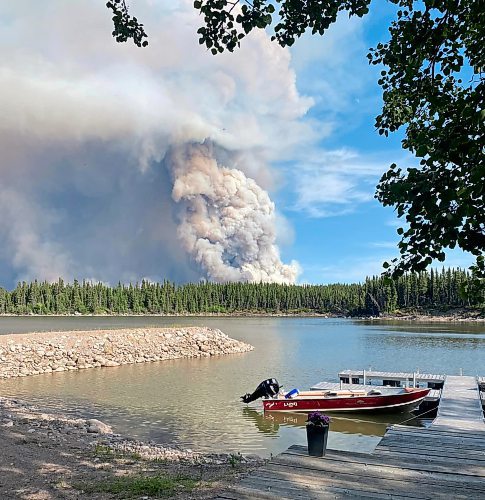 The smoke from the wildfire seen from Churchill River Lodge. A study found human-caused climate change made it seven times more likely to see a season with the same fire severity as 2023, and doubled the likelihood of extreme fire weather conditions. (Winnipeg Free Press)