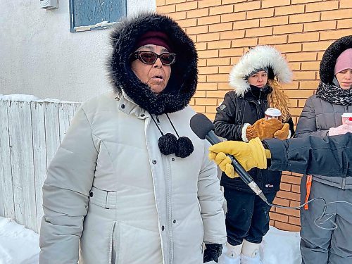 Beverley Courchene, Leah Keeper’s mother, canvassed the North End with volunteers seeking information on her daughter’s disappearance Saturday.  (Malak Abas / Winnipeg Free Press)