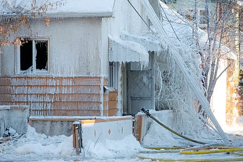 BROOK JONES / WINNIPEG FREE PRESS
Firefighters with Winnipeg Fire Paramedic Service responded to a fire in a two-and-a-half-storey multi-family house in the 100 block of Rex Avenue in Winnipeg, Man., around 11:20 a.m., Sunday, Jan. 14, 2024. By 3:30 p.m. crews were clearing the scene as the house, which was seriously damaged by fire, continued to smolder.