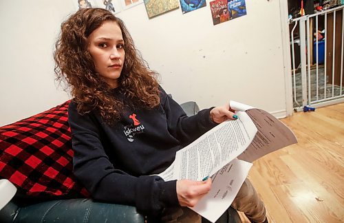 JOHN WOODS / WINNIPEG FREE PRESS
Cambria Harris, daughter of Morgan Harris, is photographed as she reads the human rights complaint against the MB Progressive Conservative Party she and other families have filed, in her home in Winnipeg Monday, January 15, 2024. 

Reporter: tyler