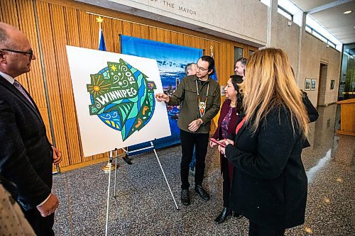 MIKAELA MACKENZIE / WINNIPEG FREE PRESS
	
Artist Jordan Stranger and mayor, councillors, and staff take a look at the new Winnipeg 150 graphic at City Hall on Monday, Jan. 15, 2024. For Tyler story.
Winnipeg Free Press 2023