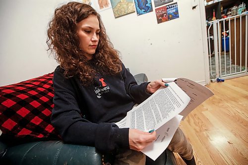 JOHN WOODS / WINNIPEG FREE PRESS
Cambria Harris, daughter of Morgan Harris, is photographed as she reads the human rights complaint against the MB Progressive Conservative Party she and other families have filed, in her home in Winnipeg Monday, January 15, 2024. 

Reporter: tyler