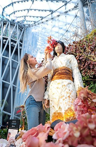RUTH BONNEVILLE / WINNIPEG FREE PRESS

ENT - Fleurs de Villes VOYAGE 

Britney Fache floral designer and owner of  Fache Florals, has created a kimono using plant material. Her display is one of 15 one-of-a-kind floral mannequins inspired by global travel destinations and created by local florists using fresh flowers and other natural plant material. 

Photos of Britney Fache as she spruces up her display Tuesday. 

Story: Fleurs de Villes VOYAGE at The Leaf. Fleurs de Villes VOYAGE  is a travel-themed floral showcase on display at The Leaf in Assiniboine Park from Jan 11 - 21st.

 
Jan 16th, 2024