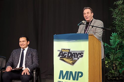 16012024
Manitoba Agriculture Minister Ron Kostyshyn speaks as Premier Wab Kinew smiles during the dignitaries address in the MNP Theatre during Manitoba Ag Days 2024 at the Keystone Centre on Tuesday.
(Tim Smith/The Brandon Sun)
