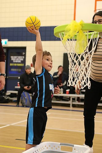 Little Ballers player Oliver Moreira extends to dunk on a plastic rim. (Thomas Friesen/The Brandon Sun)