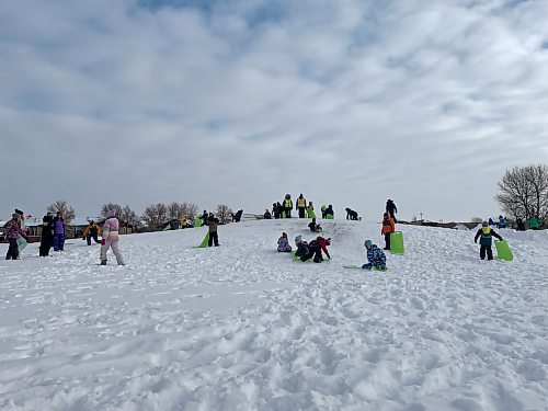 Elementary students at École St. Germain toboggan and build snow forts during recess on Jan. 17, 2023. MAGGIE MACINTOSH/WINNIPEG FREE PRESS