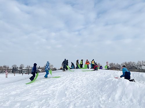 MAGGIE MACINTOSH / WINNIPEG FREE PRESS
Elementary students at &#xc9;cole St. Germain toboggan and build snow forts during recess on Jan. 17, 2024. 