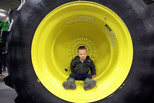 17012024
Two-year-old Austin Hird of Killarney explores the wheel well of a combine during Manitoba Ag Days 2024 at the Keystone Centre on Wednesday.
(Tim Smith/The Brandon Sun)