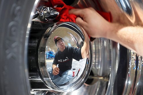 15012024
Kris Friesen with Load Line polishes the rims on a grain truck while setting up for Manitoba Ag Days 2024 at the Keystone Centre on Monday. (Tim Smith/The Brandon Sun)