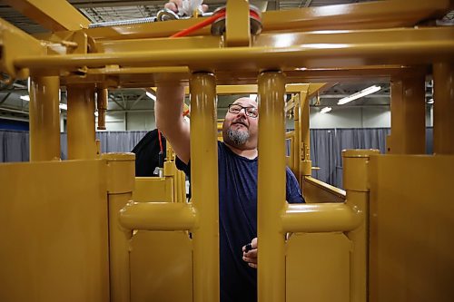 15012024
Gus Vigier with Tuff Livestock Equipment polishes a squeeze chute during setup for Manitoba Ag Days 2024 at the Keystone Centre on Monday. (Tim Smith/The Brandon Sun)