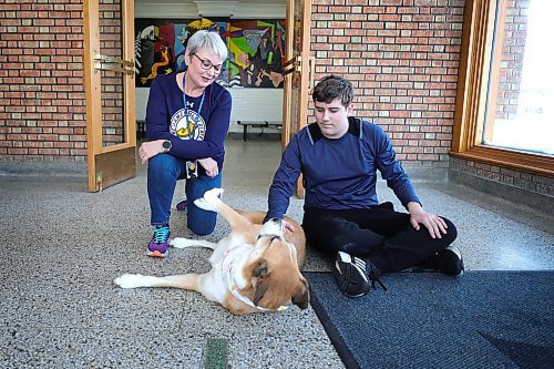 RUTH BONNEVILLE / WINNIPEG FREE PRESS

LOCAL - therapy dogs

Photo of therapy dog, Daisy, hanging out in the hall with grade 11 student, Jakob Stobbs with Daisy's owner, Robyn King (school secretary) at St. James Collegiate Wednesday.

SCHOOL THERAPY DOGS: Ahead of exam season, St. James Collegiate recruited a new therapist to ease student anxieties. Meet Daisy: a canine trained in supporting students and staff with stress and behaviour challenges. Daisy is the division's newest addition to its therapy-dog-in-residence program. She joins a beloved retriever named Charlie. We're stopping by the school to see Daisy and Charlie in action. 

Subject: Students with therapy dogs Daisy (new addition) and Charlie 
Reporter - Maggie 

Jan 17th, 2024
