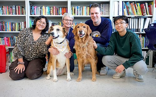 RUTH BONNEVILLE / WINNIPEG FREE PRESS

LOCAL - therapy dogs

Photo of grade 9 students, Kat Aseron (left) and Aldrin Javier (far right) hanging out with Daisy, left and Charlie (retriever), with Daisy's owner, Robyn King (school secretary) and Geret Coates (Enflish teacher), owner of Charlie the retriever, at St. James Collegiate Wednesday.

SCHOOL THERAPY DOGS: Ahead of exam season, St. James Collegiate recruited a new therapist to ease student anxieties. Meet Daisy: a canine trained in supporting students and staff with stress and behaviour challenges. Daisy is the division's newest addition to its therapy-dog-in-residence program. She joins a beloved retriever named Charlie. We're stopping by the school to see Daisy and Charlie in action. 

Subject: Students with therapy dogs Daisy (new addition) and Charlie 
Reporter - Maggie 

Jan 17th, 2024