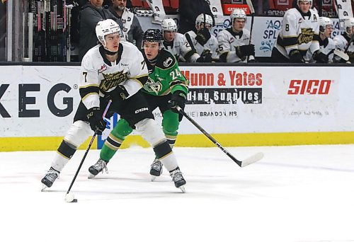 Brandon Wheat Kings defenceman Charlie Elick (7) skates away from Prince Albert Raiders forward Niall Crocker (24) last Sunday at Westoba Place. Elick plays on the team's top defensive pairing with Quinn Mantei. (Perry Bergson/The Brandon Sun)
 