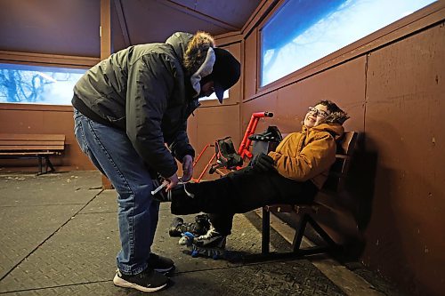 19012024
Jason Kissock helps his son Sylas, 8, to tie his skates before heading out on the ice at the Brandon Skating Oval on Friday evening. (Tim Smith/The Brandon Sun)