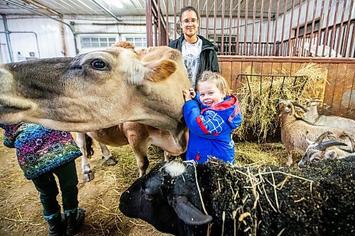 MIKAELA MACKENZIE / WINNIPEG FREE PRESS
	
Vegan kids Harley Tonge (eight, left), Fynn Solar (12), and Hale Tonge (five) with former dairy cows at the Little Red Barn Sanctuary on Thursday, Jan. 18, 2024. For green page story.
Winnipeg Free Press 2024