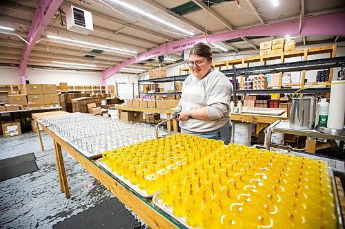 MIKAELA MACKENZIE / WINNIPEG FREE PRESS
	
Kasia Unger, customer experience manager, pours candles at the Coal and Canary Candle Company warehouse on Friday, Jan. 19, 2024. For AV story.
Winnipeg Free Press 2024