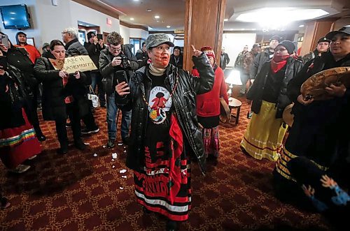 Tara Martinez spoke as people gathered in the lobby of the Marlborough Hotel to rally in support of a woman who was allegedly detained by security and handcuffed with a zip lock at the hotel on Sunday. (John Woods/Winnipeg Free Press)