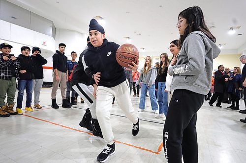 RUTH BONNEVILLE / WINNIPEG FREE PRESS

Standup - basketball fun with Mayor and council members

Harmanjit Singh of Arthur E. Wright School, plays a fun, pick-up-game of basketball against fellow student, at Maples Community Centre after city's funding announcement Monday.

Grades 7 &amp; 8 students from Arthur E. Wright School and community members attended the announcement which is awarding renovation grants to 13 community centres in the city including a new gym floor for  Maples Community Centre.

All in attendance:
Mayor Scott Gillingham
Evan Duncan, Chairperson of the Standing Policy Committee on Community Services
Devi Sharma, Councillor for Old Kildonan
Lora Meseman, Executive Director, General Council of Winnipeg Community Centres
 



Jan 22nd 2024