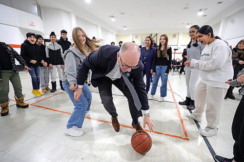 RUTH BONNEVILLE / WINNIPEG FREE PRESS

Standup - basketball fun with Mayor and council members

Mayor Scott Gillingham, plays a fun game of basketball with Arthur E. Wright School student, Olha Durniak, after announcement Monday. 


Mayor Scott Gillingham and Devi Sharma, Councillor for Old Kildonan, play a fun, pick-up- game of basketball with students from Arthur E. Wright School after funding  announcement at Maples Community Centre Monday morning.  

Grades 7 &amp; 8 students from Arthur E. Wright School and community members attended the announcement which is awarding renovation grants to 13 community centres in the city including a new gym floor for  Maples Community Centre.

All in attendance:
Mayor Scott Gillingham
Evan Duncan, Chairperson of the Standing Policy Committee on Community Services
Devi Sharma, Councillor for Old Kildonan
Lora Meseman, Executive Director, General Council of Winnipeg Community Centres
 



Jan 22nd 2024