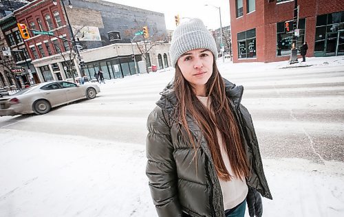 JOHN WOODS / WINNIPEG FREE PRESS
Claire Johnstone, an artist featured in this year&#x2019;s Lights On The Exchange, is photographed on Main St. at Bannatyne Ave. in Winnipeg in front of her lantern Lii Faam Michif Mashkawishiwak pi Tipeemishowak (Metis women are strong and free/own themselves) Monday, January 22, 2024. Her piece depicts Annie Bannatyne, a 19th century Metis woman and philanthropist, and is placed on top of the former Birt&#x2019;s Saddlery building on Main at Bannatyne.

Reporter: Eva