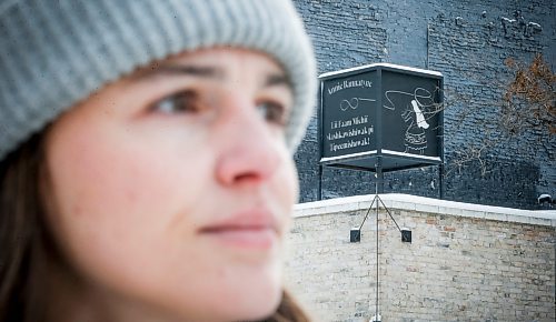 JOHN WOODS / WINNIPEG FREE PRESS
Claire Johnstone, an artist featured in this year&#x2019;s Lights On The Exchange, is photographed on Main St. at Bannatyne Ave. in Winnipeg in front of her lantern Lii Faam Michif Mashkawishiwak pi Tipeemishowak (Metis women are strong and free/own themselves) Monday, January 22, 2024. Her piece depicts Annie Bannatyne, a 19th century Metis woman and philanthropist, and is placed on top of the former Birt&#x2019;s Saddlery building on Main at Bannatyne.

Reporter: Eva