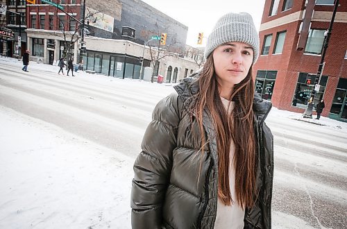 JOHN WOODS / WINNIPEG FREE PRESS
Claire Johnstone, an artist featured in this year&#x573; Lights On The Exchange, is photographed on Main St. at Bannatyne Ave. in Winnipeg in front of her lantern Lii Faam Michif Mashkawishiwak pi Tipeemishowak (Metis women are strong and free/own themselves) Monday, January 22, 2024. Her piece depicts Annie Bannatyne, a 19th century Metis woman and philanthropist, and is placed on top of the former Birt&#x573; Saddlery building on Main at Bannatyne.

Reporter: Eva