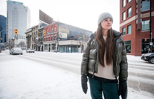 JOHN WOODS / WINNIPEG FREE PRESS
Claire Johnstone, an artist featured in this year&#x2019;s Lights On The Exchange, is photographed on Main St. at Bannatyne Ave. in Winnipeg in front of her lantern Lii Faam Michif Mashkawishiwak pi Tipeemishowak (Metis women are strong and free/own themselves) Monday, January 22, 2024. Her piece depicts Annie Bannatyne, a 19th century Metis woman and philanthropist, and is placed on top of the former Birt&#x2019;s Saddlery building on Main at Bannatyne.

Reporter: Eva