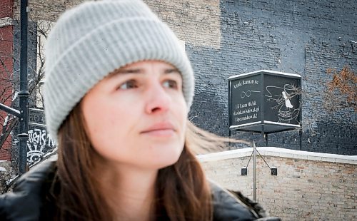 JOHN WOODS / WINNIPEG FREE PRESS
Claire Johnstone, an artist featured in this year&#x2019;s Lights On The Exchange, is photographed on Main St. at Bannatyne Ave. in Winnipeg in front of her lantern Lii Faam Michif Mashkawishiwak pi Tipeemishowak (Metis women are strong and free/own themselves) Monday, January 22, 2024. Her piece depicts Annie Bannatyne, a 19th century Metis woman and philanthropist, and is placed on top of the former Birt&#x2019;s Saddlery building on Main at Bannatyne.

Reporter: Eva