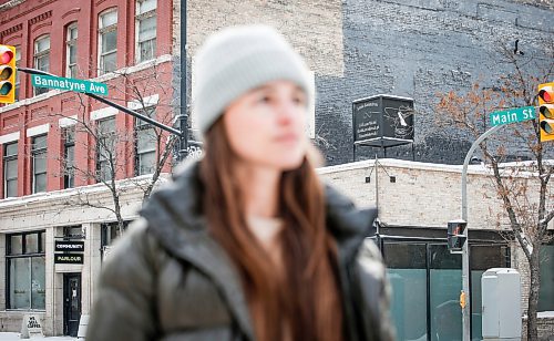 JOHN WOODS / WINNIPEG FREE PRESS
Claire Johnstone, an artist featured in this year&#x2019;s Lights On The Exchange, is photographed on Main St. at Bannatyne Ave. in Winnipeg in front of her lantern Lii Faam Michif Mashkawishiwak pi Tipeemishowak (Metis women are strong and free/own themselves) Monday, January 22, 2024. Her piece depicts Annie Bannatyne, a 19th century Metis woman and philanthropist, and is placed on top of the former Birt&#x2019;s Saddlery building on Main at Bannatyne.

Reporter: Eva