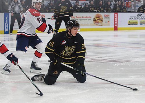 Brandon Wheat Kings forward Nick Johnson (26) continues to control the puck after being knocked to the ice as Lethbridge Hurricanes forward Dylan Sydor (10) looks on. Johnson is a power forward who has the ability to put up some points. (Photos by Perry Bergson/The Brandon Sun)