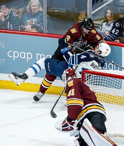 JOHN WOODS / WINNIPEG FREE PRESS
Chicago Wolves’ Tory Dello (3) defends against Manitoba Moose Dawson Barteaux (4) as goaltender Adam Scheel (31) looks on during first period AHL action in Winnipeg on Tuesday, January 23, 2024.

Reporter: josh