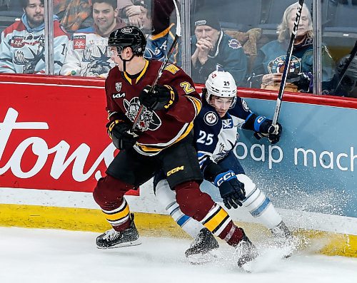 JOHN WOODS / WINNIPEG FREE PRESS
Chicago Wolves&#x2019; Griffin Mendel (2) defends against Manitoba Moose Parker Ford (25) during first period AHL action in Winnipeg on Tuesday, January 23, 2024.

Reporter: josh