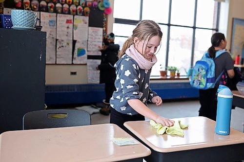 23012024
Evanka Aberhart, a grade 3/4 student at &#xc9;cole New Era School, helps clean up the classroom at the end of the school day on Tuesday. The school is the oldest in the Brandon School Division.
(Tim Smith/The Brandon Sun)
