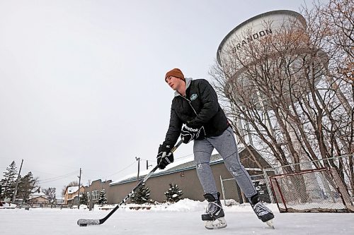 23012024
Kieran Moore stick-handles a puck at the East End Community Centre while practicing his hockey skills with friend Adam Guercio on a mild and overcast Tuesday. 
(Tim Smith/The Brandon Sun)