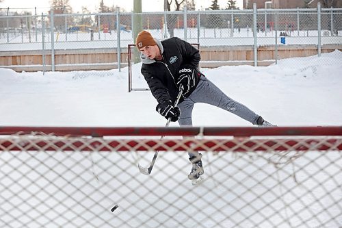 23012024
Kieran Moore takes a shot on a net at the East End Community Centre while practicing his hockey skills with friend Adam Guercio on a mild and overcast Tuesday. 
(Tim Smith/The Brandon Sun)