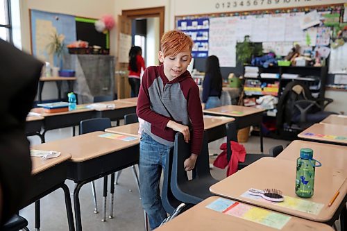 23012024
Stefan Eberts, a grade 3/4 student at &#xc9;cole New Era School, helps clean up the classroom at the end of the school day on Tuesday. The school is the oldest in the Brandon School Division.
(Tim Smith/The Brandon Sun)