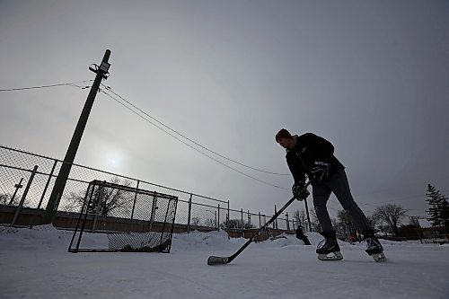 23012024
Kieran Moore takes a shot on a net at the East End Community Centre while practicing his hockey skills with friend Adam Guercio on a mild and overcast Tuesday. 
(Tim Smith/The Brandon Sun)