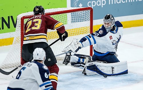 JOHN WOODS / WINNIPEG FREE PRESS
Manitoba Moose goaltender Collin Delia (60) saves the shot from Chicago Wolves&#x2019; Isaac Ratcliffe (23) during first period AHL action in Winnipeg on Tuesday, January 23, 2024.

Reporter: josh