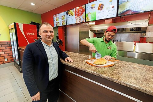MIKE DEAL / WINNIPEG FREE PRESS
Mohamad Jumaily, founder of Mr. Calzone, at the counter of his original location at 749 Ellice Avenue, while employee, Mouad Khabous, cuts up one of the famous calzones. Mohamad plans to grow the franchise to more than 40 companies across Canada by 2026. They are opening a fifth location on McPhillips in March.
See Gabby story
240125 - Thursday, January 25, 2024.