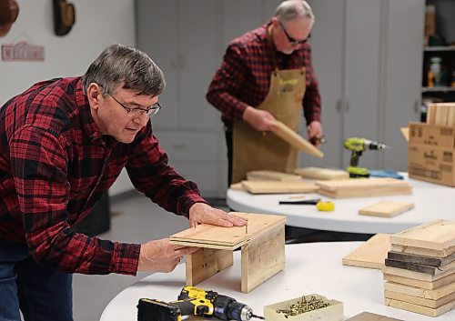 Wayne Yonda and George Michniewicz are part of a group of six who volunteered to construct 25 nest boxes in support of the non-profit Friends of the Bluebirds organization. (Michele McDougall/The Brandon Sun)