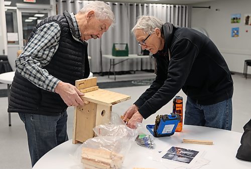 Lloyd McCabe and Larry Grime put the finishing touches on a nest box on Thursday at Seniors for Seniors Co-op Inc. in Brandon. (Michele McDougall/The Brandon Sun)