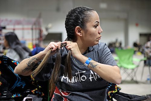 26012024
Nadine Obey of Regina braids her hair while preparing for the women&#x2019;s fancy dance category at the Dakota Nation Winterfest Powwow at the Keystone Centre on Friday evening. The weekend-long Winterfest includes square dancing, Moccasin games, basketball, volleyball and a variety of other events.
(Tim Smith/The Brandon Sun)
