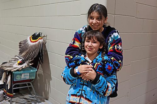 26012024
Nikki Wanbdiska of Sioux Valley Dakota Nation embraces her younger sister Mila prior to the Powwow Grand Entry.
(Tim Smith/The Brandon Sun)
