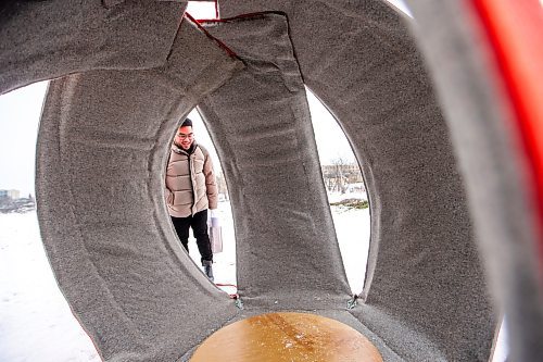 MIKAELA MACKENZIE / WINNIPEG FREE PRESS
	
Kristian Escoto checks out new 2024 warming hut Spinning Dim Sum at The Forks on Friday, Jan. 26, 2024. For photo page.
Winnipeg Free Press 2024