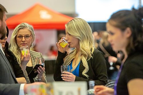 BROOK JONES / WINNIPEG FREE PRESS
Andrea Kozuska (right) and her friend Samantha Gray both enjoy a cup of jalap&#x113;no pineapple margaretta while attending the public tastings inside the OTR On the Rocks cocktail lounge at the Winnipeg Wine Festival at the RBC Convention Centre in Winnipeg, Man., Friday, Jan. 26, 2024.