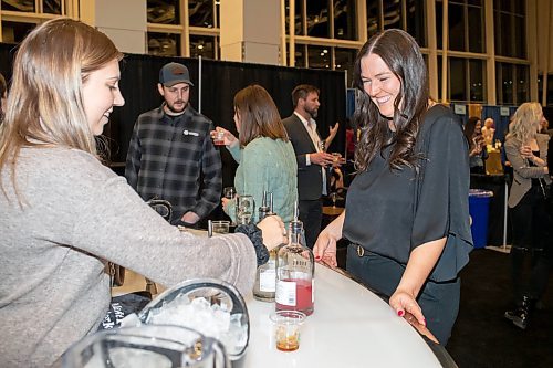 BROOK JONES / WINNIPEG FREE PRESS
Winnipeg resident Emily Sanders (right) is all smiles while Katelyn Bilyk from OTR On the Rock gets ready to pour a pre-made espresso martini on the rocks for her during the public tastings inside the cocktail lounge at the Winnipeg Wine Festival at the RBC Convention Centre in Winnipeg, Man., Friday, Jan. 26, 2024.