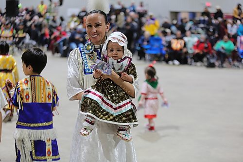 Mya One Arrow, 8 months, is carried by Bobbi Lynn Frederick during the Tiny Tots dance at the WinterFest celebration on Saturday at the Manitoba Room of Keystone Centre. Organizer Jocelyn Ross says the festival, which is the 26th edition, is one of Sioux Valley’s most important celebrations. From powwow to jigging, singing, sports events and traditional games, with more than 75 hockey teams registered, the weekend was a busy one. Photos: Abiola Odutola/The Brandon Sun