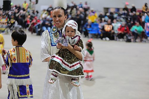 Mya One Arrow, 8 months, is carried by Bobbi Lynn Frederick during the Tiny Tots dance at the WinterFest celebration on Saturday at the Manitoba Room of Keystone Centre. Organizer Jocelyn Ross says the festival, which is the 26th edition, is one of Sioux Valley’s most important celebrations. From powwow to jigging, singing, sports events and traditional games, with more than 75 hockey teams registered, the weekend was a busy one. Photos: Abiola Odutola/The Brandon Sun