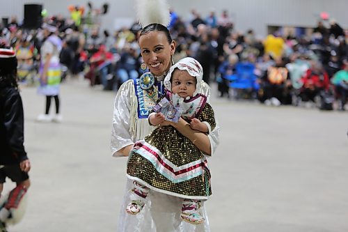 Mya One Arrow, 8 months, is carried by Bobbi Lynn Frederick during the Tiny Tots dance at the WinterFest celebration on Saturday at the Manitoba Room of Keystone Centre. Photos: Abiola Odutola/The Brandon Sun